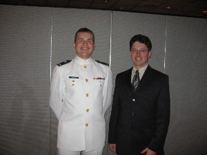 Cadet Thomas Laucys (l) is recognized by chapter president Dr. Gregory Johnson with an AFCEA award after graduating from the Coast Guard Academy in May. Laucys will be commissioned an ensign in the Lithuanian Navy.